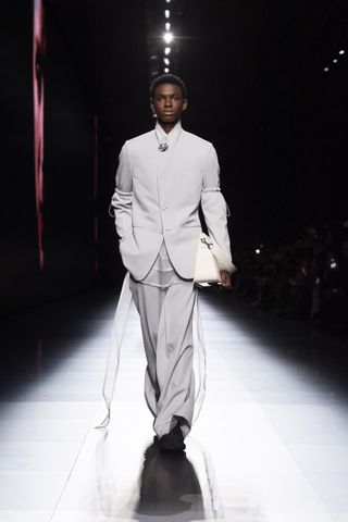Model on Dior runway in suit