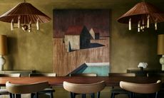 Dining room with deep khaki green washed walls 