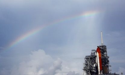 A rainbow appears near the space shuttle Atlantis, which is poised to take its final flight on Friday, ending the 30-year shuttle program.