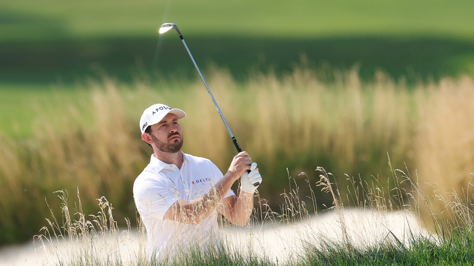 Patrick Cantlay hits a bunker shot