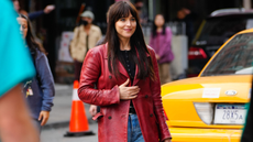 Dakota Johnson in New York wearing a red blazer and blue jeans