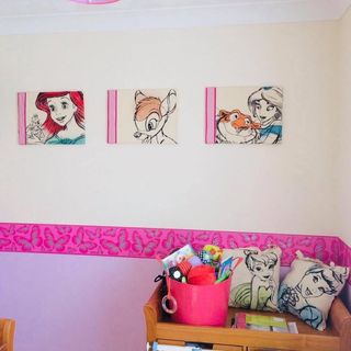 bedroom with multicolor wall cushions toys and cartoon pictures