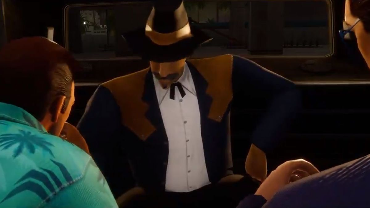 Man in limo chatting to two others only partially in shot