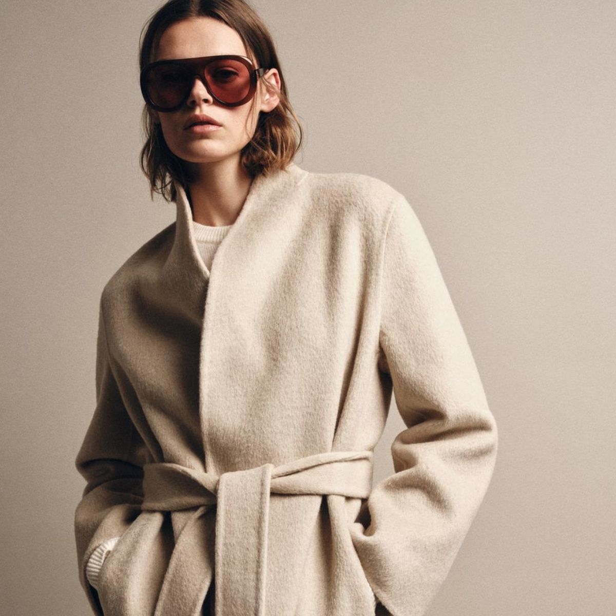 model wearing cream zara coat