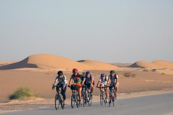 A small bunch of riders pass through