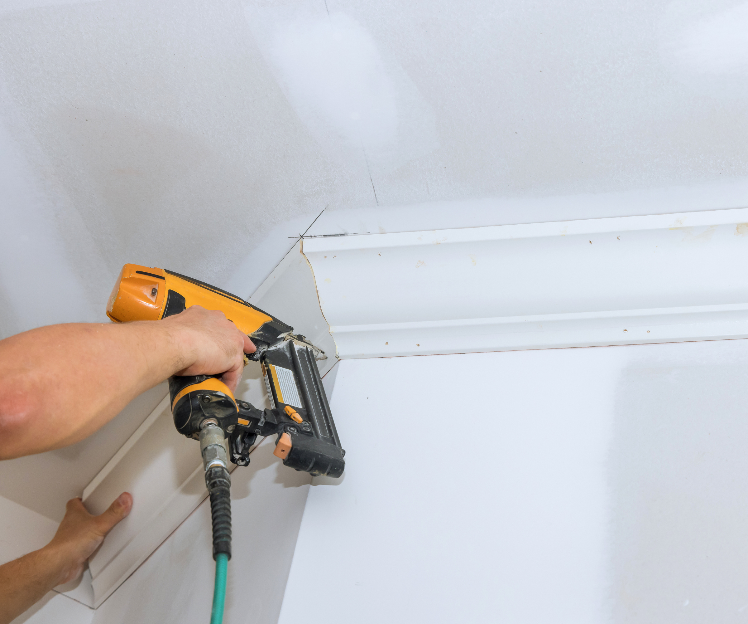 coving being installed with nail gun