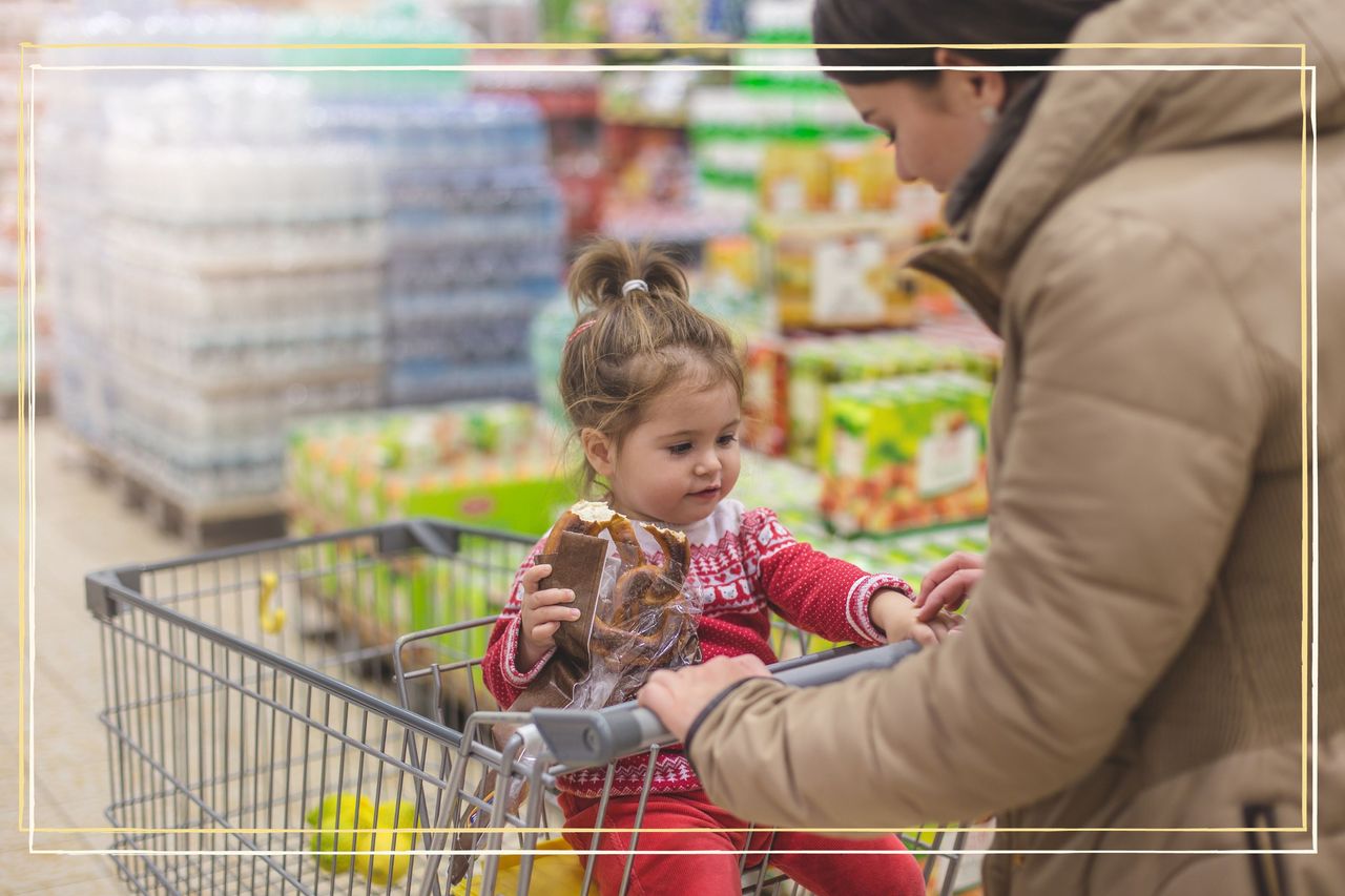 mum and child doing food shop with trolley