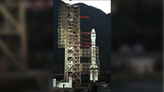 A Long March 2E rocket awaiting lift off from Xichang Space Center launch pad.