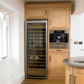 kitchen area with wine fridge and coffee maker