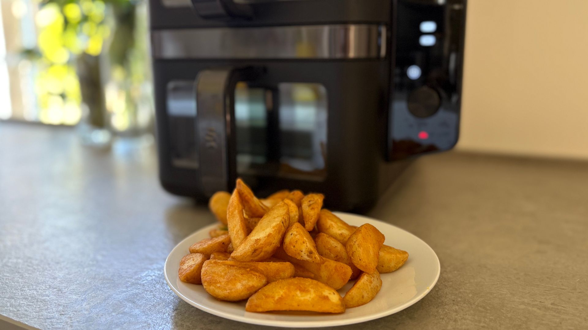 Chips cooked in the Salter VertiCook Air Fryer on a plate