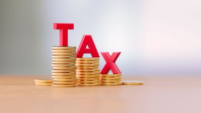word tax in red on coins for standard deduction