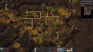 A factory on a yellow and brown planet in Factorio: Space Age.