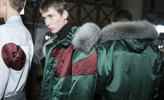 Male models wearing green and grey jackets from the Kris Van Assche AW2015 collection