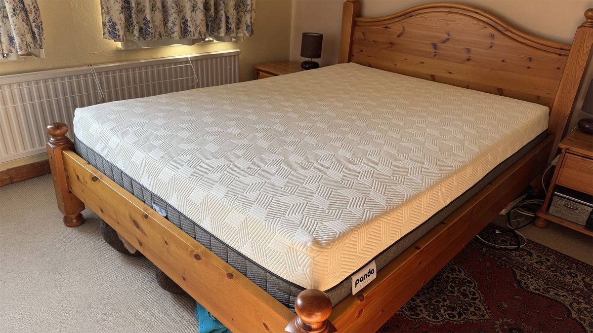 The Panda Hybrid Bamboo mattress on a wooden bed in a bedroom