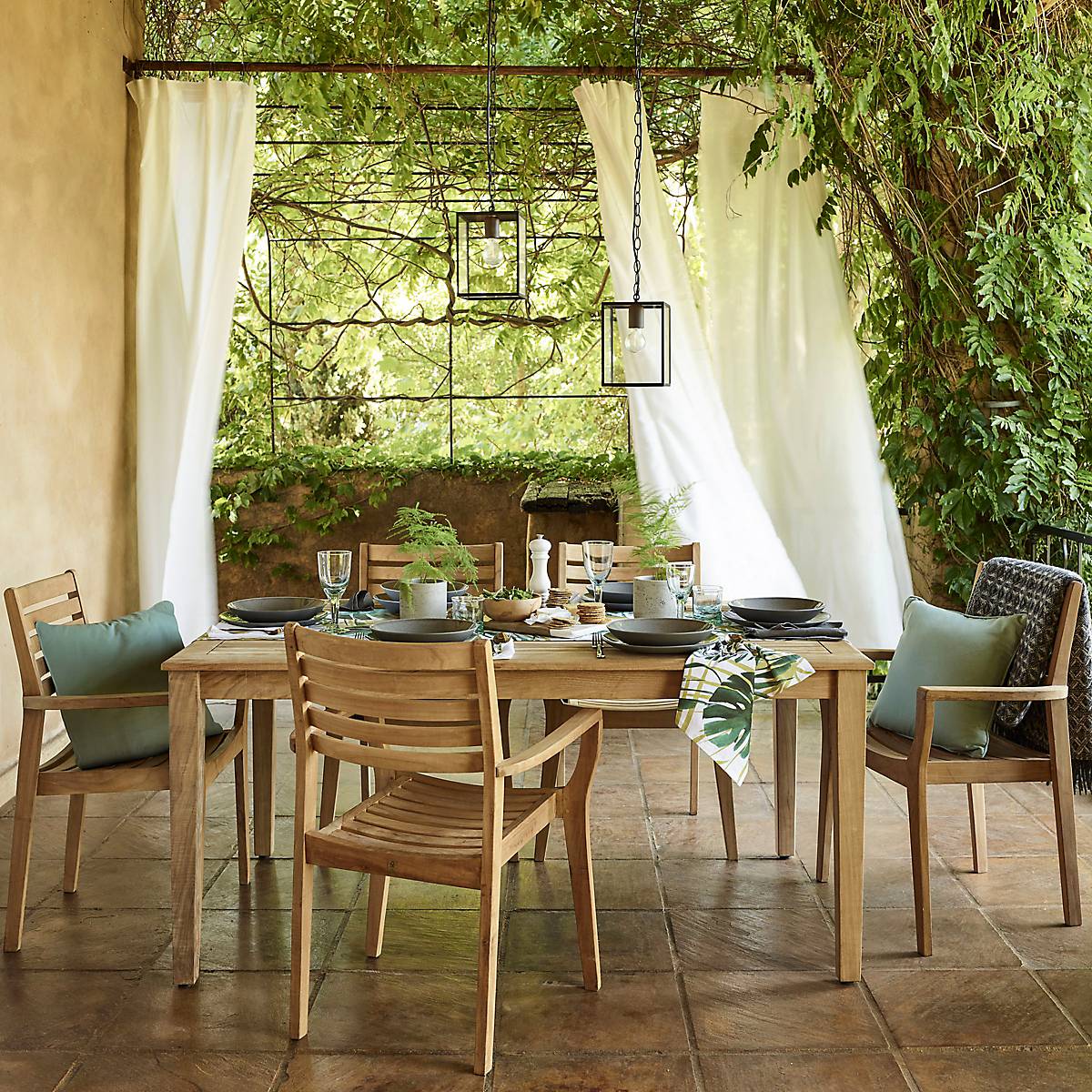 garden curtains create an outdoor living set up