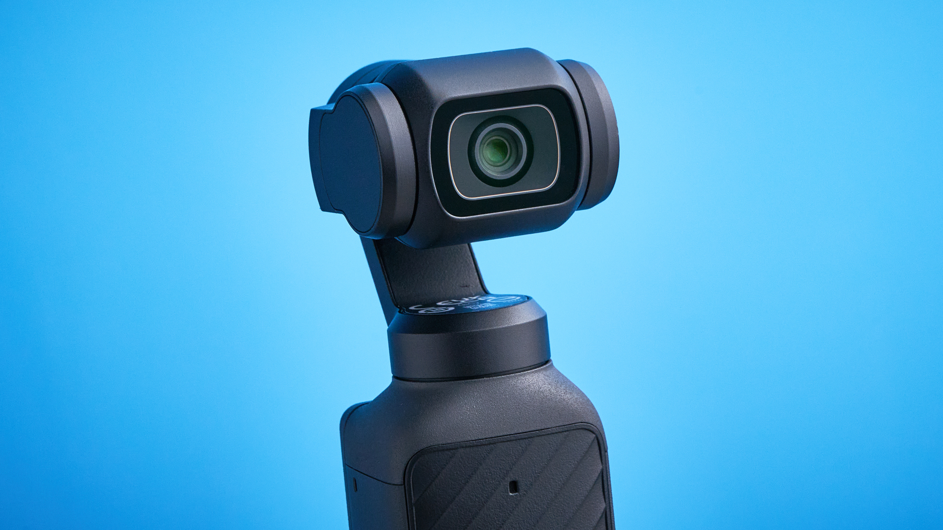 DJI Osmo Pocket 4 against a blue background
