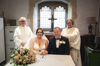 Two women officiating an opposite-sex church wedding