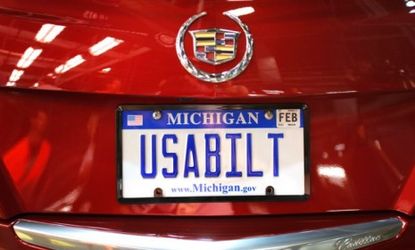 The license plate on the first 2013 Cadillac ATS available for retail is shown after the vehicle rolls off the assembly line at a General Motors plant on July 26.