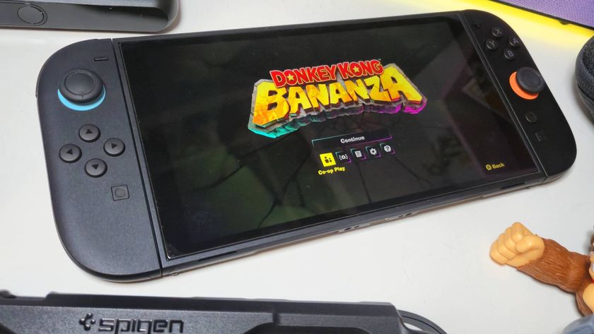 Photo of Donkey Kong Bananza running on a Switch 2 sitting on a white desk.