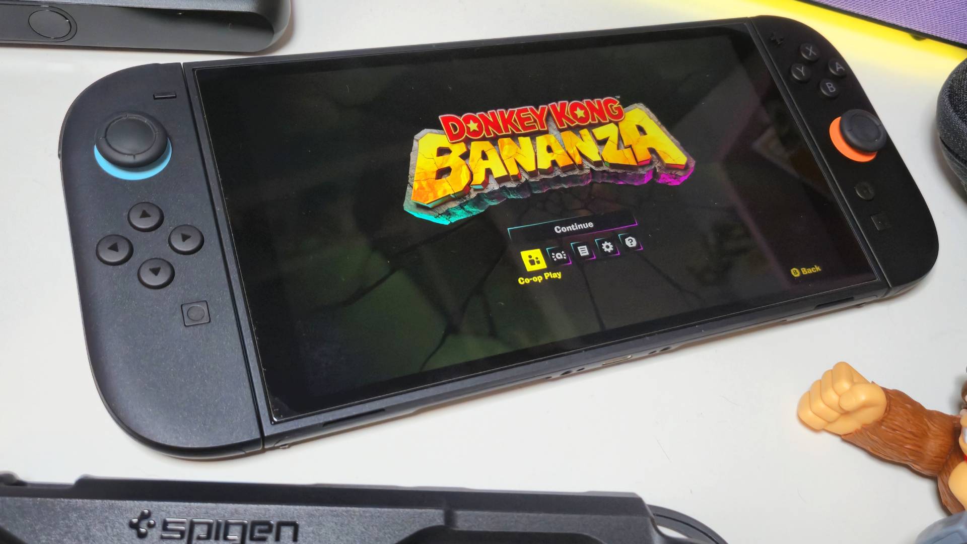 Photo by Rosalie Newcombe of Donkey Kong Bananza running on a Switch 2 sitting on a white desk.