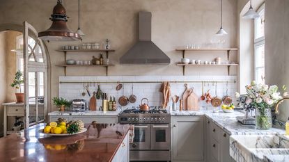 Rustic style kitchen with limewashed walls and painted cabinetry