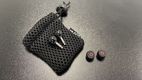 Flare Audio Isolate Pro earplugs and spare tips on a mesh bag