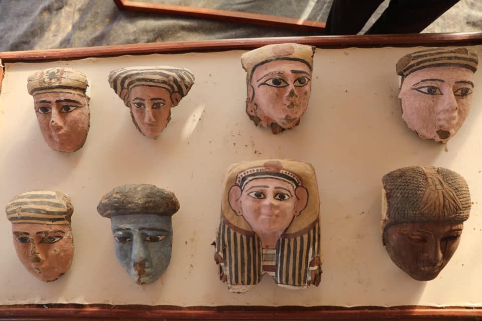 Several funerary masks discovered within the tomb.