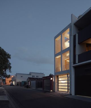 Exterior of a house with lights on