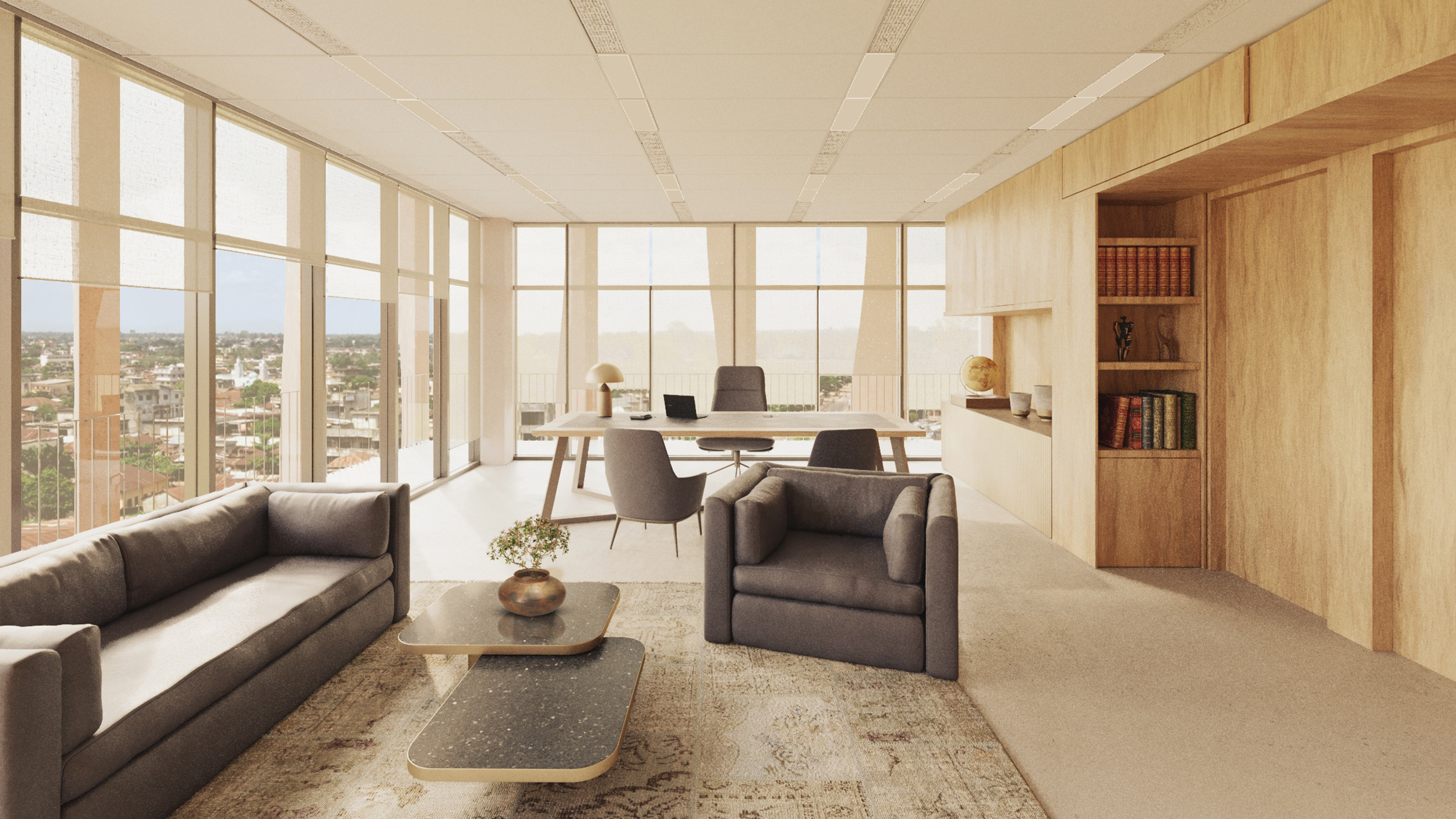 An office space in the grand assembly hall building featuring clear glass floor to ceiling panels, grey sofas with matching coffee table. Behind the sofa is an office desk chair with oak coloured cabinet on the right.