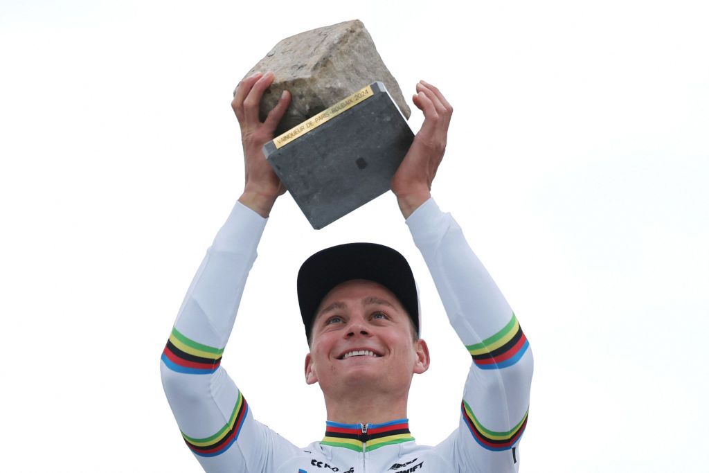 Alpecin - Deceuninck team&#039;s Dutch rider Mathieu Van Der Poel celebrates on the podium after winning the 121st edition of the Paris-Roubaix one-day classic cycling race, 260km between Compiegne and Roubaix, northern France, on April 7, 2024. (Photo by Francois LO PRESTI / AFP)