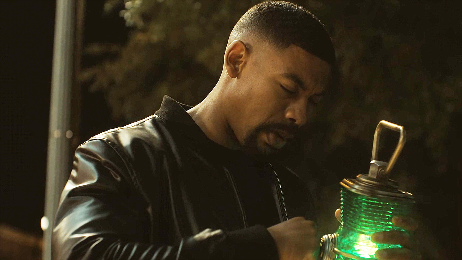 John Stewart charging Hal Jordan's Green Lantern ring at night in the Lanterns season 1 finale