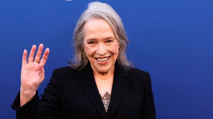 kathy bates on a blue background