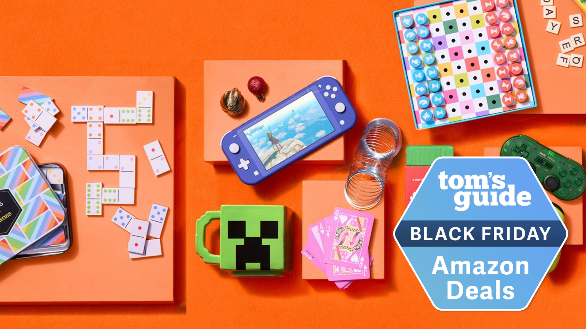 Nintendo Switch Lite, domino set, and other toys shown against orange background