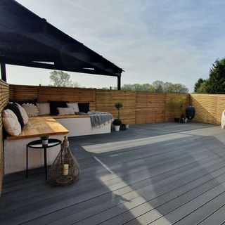 Grey composite decking with outdoor corner sofa