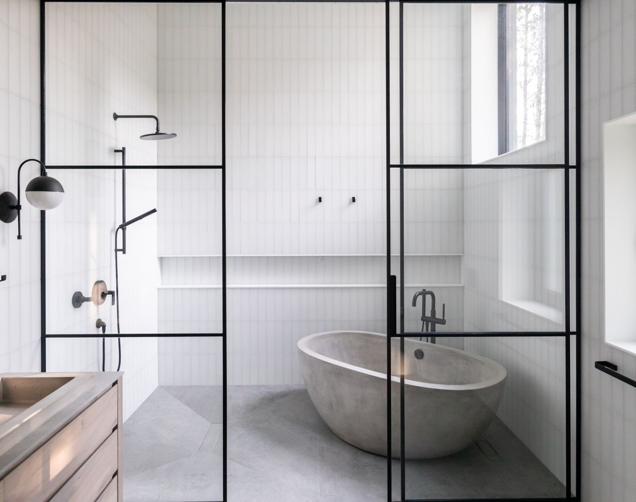 A bathroom with a partitioned shower room