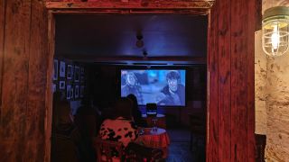 A movie screening of A Panic at Needle Park inside a small room in a pub.