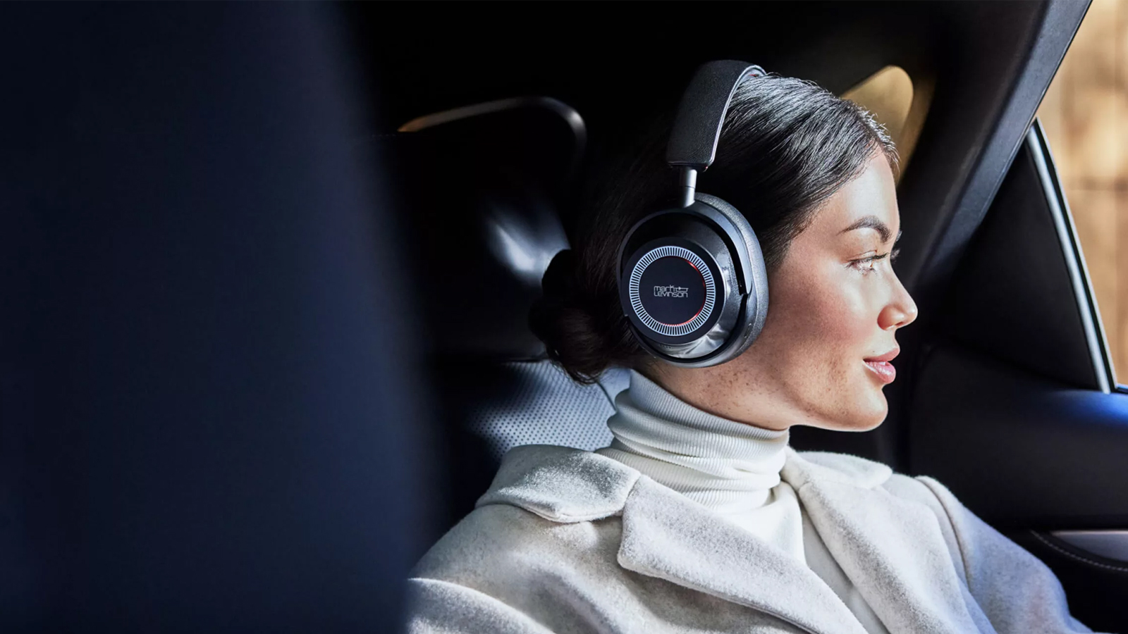 a woman wearing a pair of mark levinson headphones