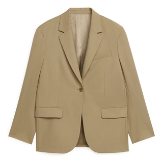 A camel blazer from Arket perfect when working out how to style jeans