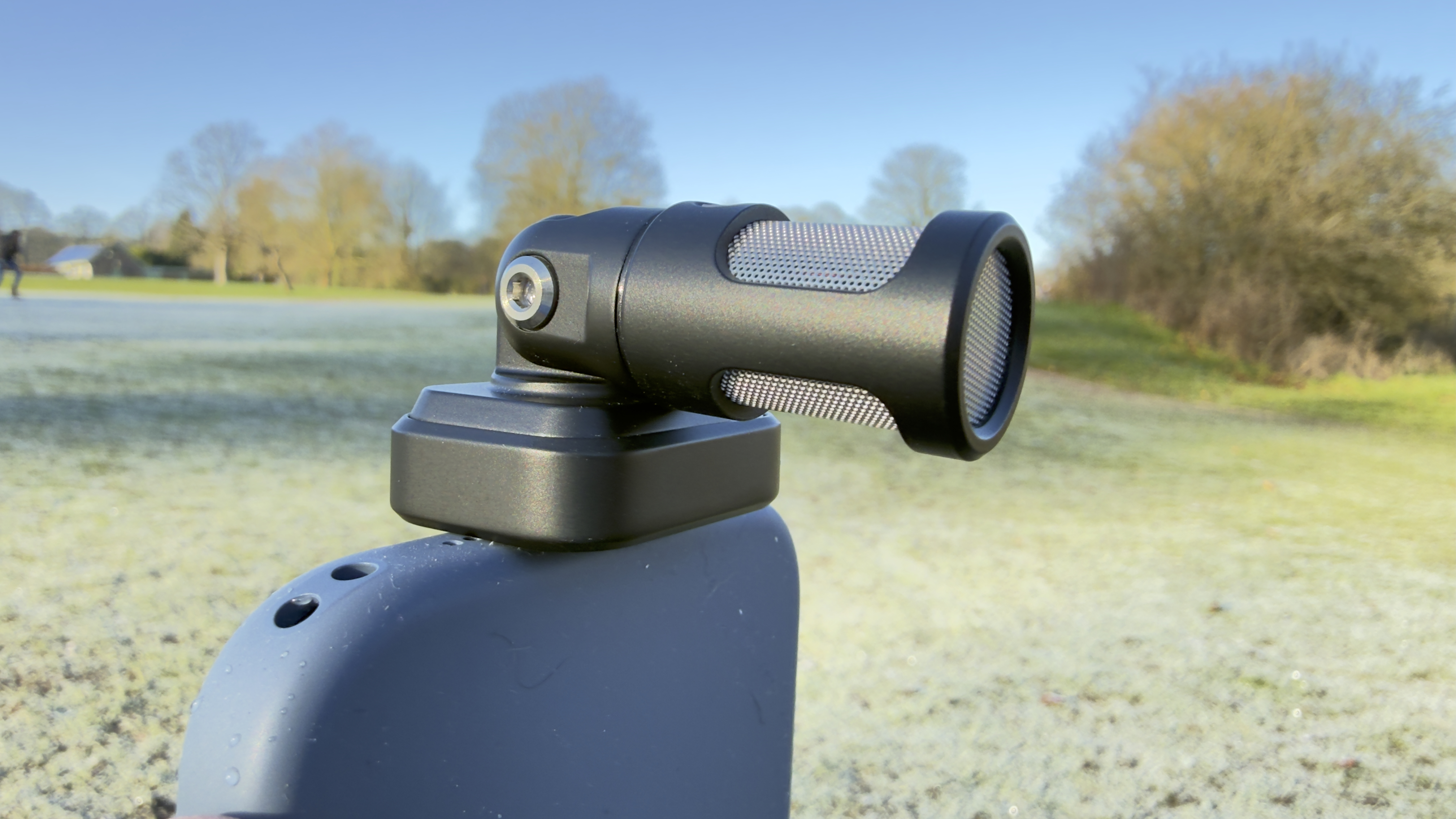 The MV88 plugged into an iPhone 17&rsquo;s USB-C port. The mic has been rotated to point horizontally