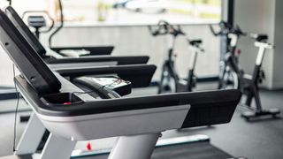 Treadmills, exercise bikes, and cross trainer in a gym