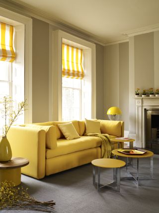yellow striped roman blinds in living room