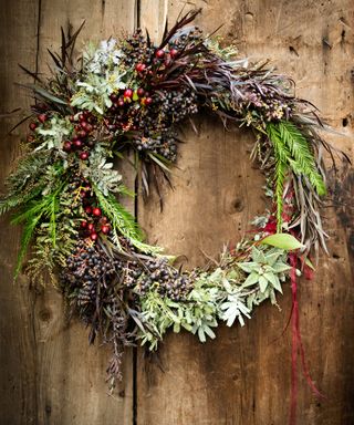natural homemade Christmas wreath on a wooden table