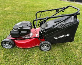 handle folded down on the Mountfield HP185 139cc lawn mower