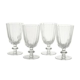 Four drinking glasses on white background