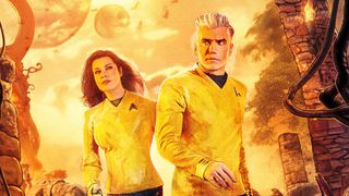 a male starship captain and the female first officer in a yellow uniform on a yellow-hued alien world