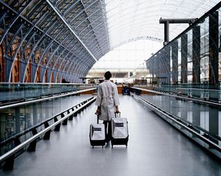 Dror For Tumi London - woman pulling luggage in airport