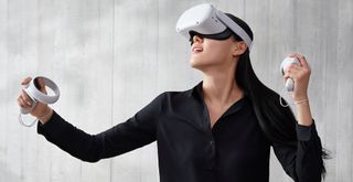 A woman wearing an Oculus Quest 2.