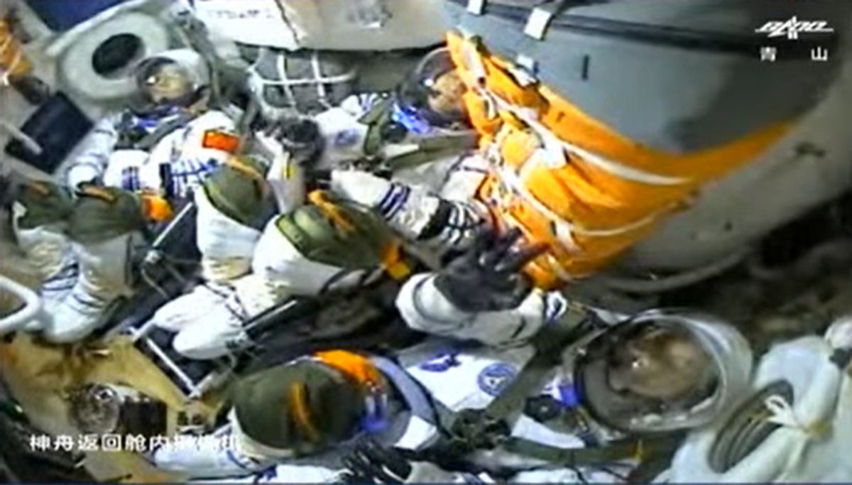 China's three Shenzhou 12 astronauts inside their spacecraft during their launch to space.
