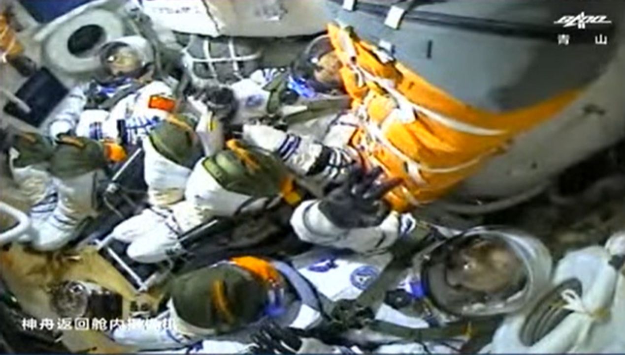 China's three Shenzhou 12 astronauts inside their spacecraft during their launch to space.