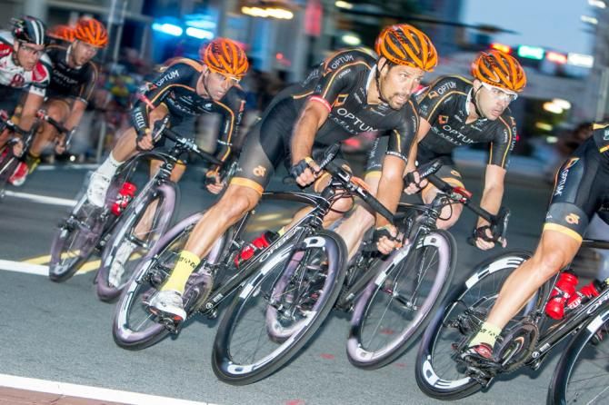 Alex Candelario (Optum) gathers teammates Eric Young and Ken Hanson at the front.
